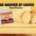 The Wonder of Under book is sitting on a sofa.