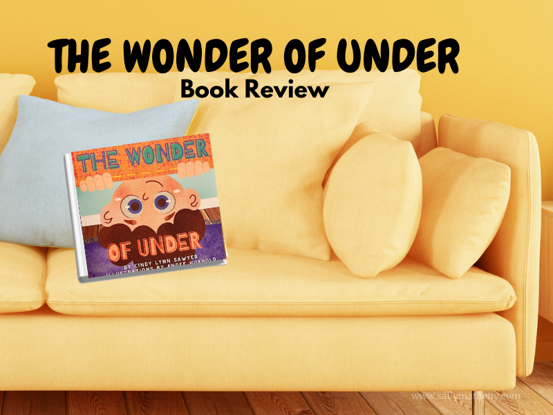 The Wonder of Under book is sitting on a sofa.